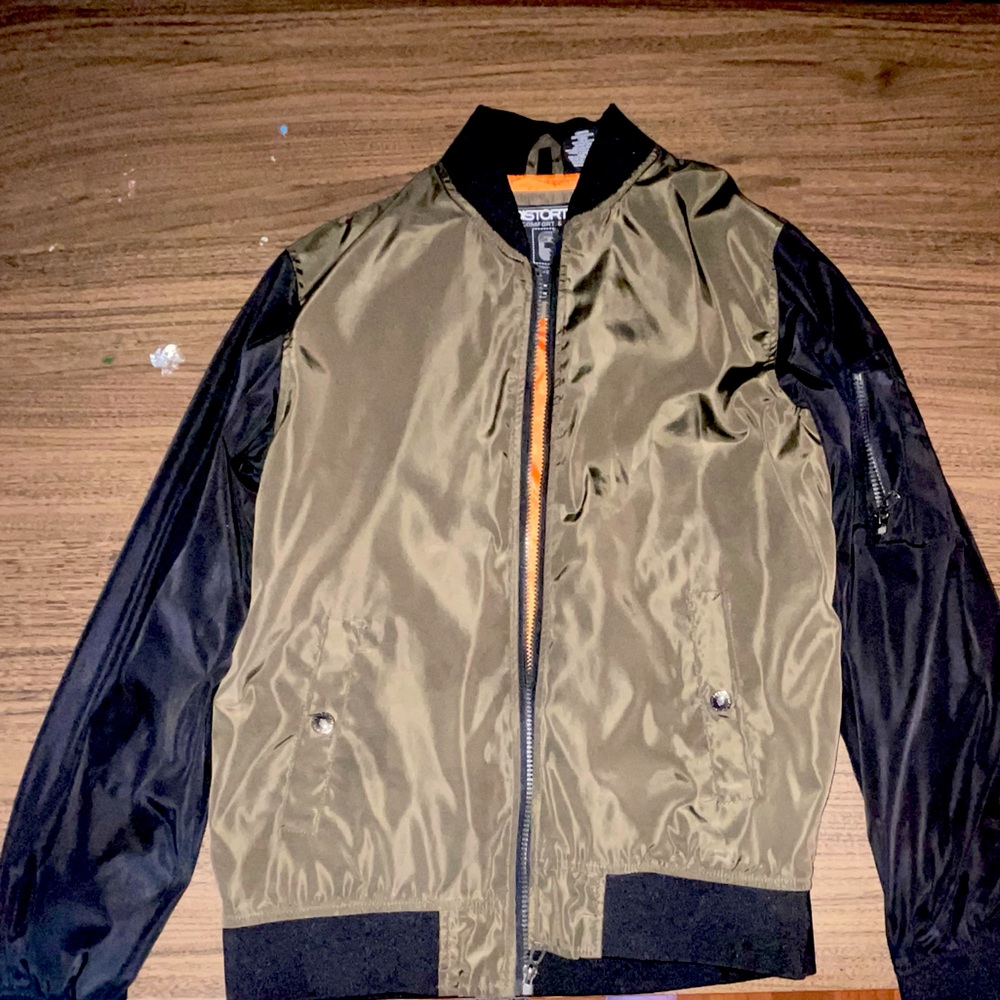 Distortion bomber jacket. A hole on the sleeve, can be mended.